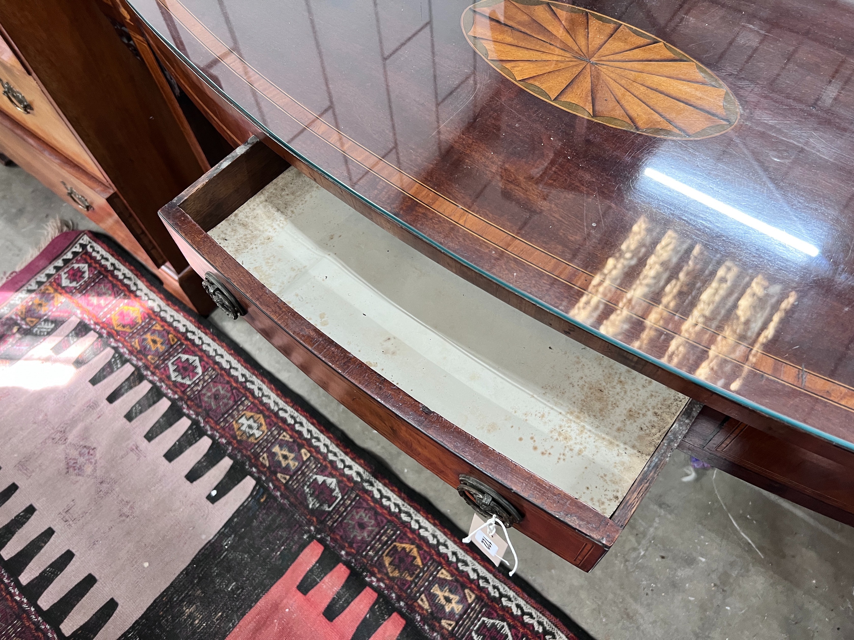A George III inlaid mahogany bow front serving table, length 140cm, depth 47cm, height 84cm *Please note the sale commences at 9am.